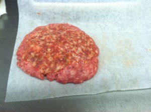 Form a firm ball with ground beef and then flatten with sausage on one side.