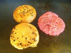 Butter Buns and lay beef side down onto grill or two separate frying pans.
