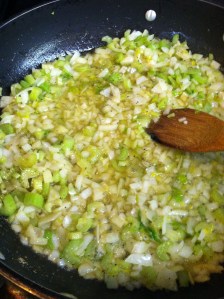 Melt butter and saute onions and celery till translucent.   