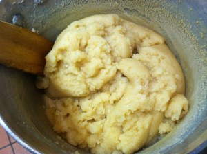 Cook out moisture from dough and once it pulls away from pot it is ready to be transferred to mixer.