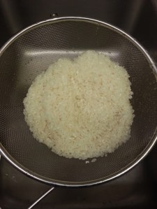 Wash rice and strain while sauteing other ingredients.  