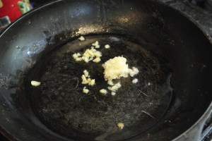 Heat pan with oil, add 3 parts garlic and 1 part ginger.