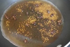 Add vinegar and reduce to half.