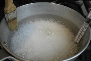 Use a brush with water if sugar boils overl and reduce heat.