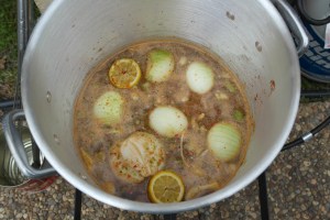 Add lemon, creole seasoning, chicken bouillon, and beer to stock. 