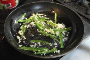 Heat pan and add vegetable oil, garlic, ginger and jalapenos.