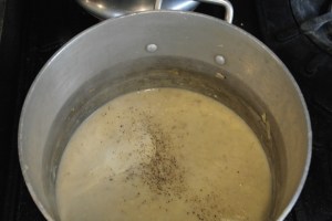 Add 2 cans of evaporated milk, salt, pepper, more garlic, thyme and nutmeg.