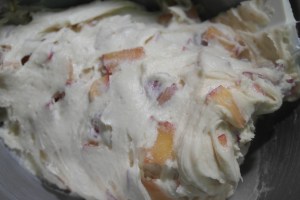 Gently fold in plums and distribute between two lined loaf pans.