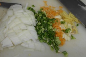 Onions, jalapenos, habaneros. garlic and ginger.