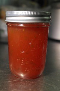 Ladle into jars and use a wooden stick to remove air from jar.  Wipe jars clean and place lid and ring.  Bake for 10 minutes.  Remove and allow jelly to cool and set.