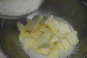 Add melted butter to cold butter....  Yummy.