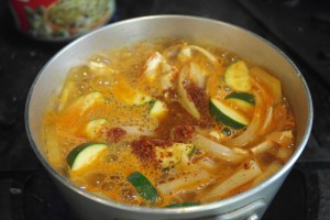 Add chili flakes, garlic, ginger and beef dashida.