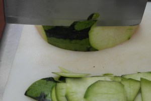 Remove skin by slicing down with knife.  