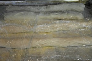 Divide and stretch. Wrap again and allow to rise 25 minutes.