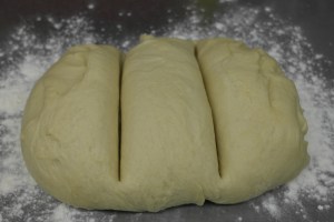 Punch dough and divide into thirds.