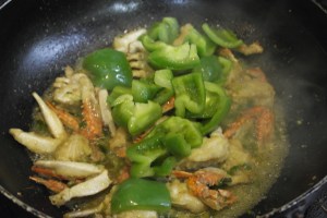 Reduce sauce by half.  Add bell peppers and toss several times and remove from pan.