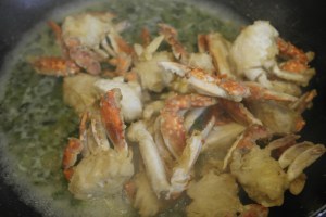 Bring sauce to boil and add crab.