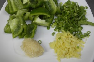 Chop a bell pepper, 2 Tbsp garlic, 2 Tbsp Ginger and 1 green onion.