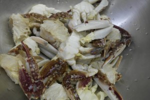 Section the crab and cut the tips of all the legs.