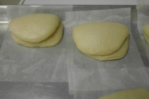 Carefully open apart the buns while they're warm.  Cool completely and they can be stored frozen.
