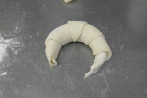 Slightly curve into a crescent.