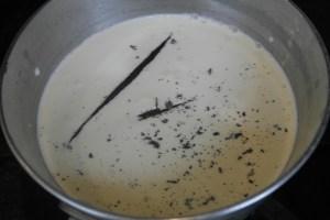Add cup of milk and scraped seeds and vanilla pod.