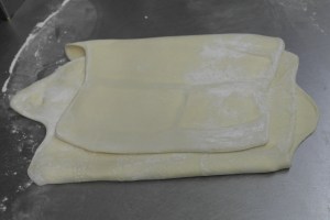 Fold into thirds like a letter and roll out again.  Place in freezer for 20 minutes and repeat.  If butter starts to soften, keep in freezer longer or you'll have a big mess.