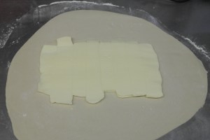 Roll dough out and add butter block.