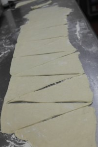 Cut triangles from one 5" hash to the next.