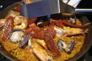 Paella - The classic, made with Bomba rice, Jamon Serrano - Shellfish broth, roasted tomato, Chorizo, Gulf Prawns, Clams and Lemon Aioli.