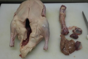 Remove the neck, gizzard and organs.