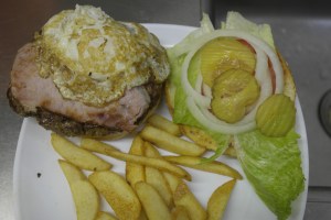 Add lettuce, tomato, onion and pickles.