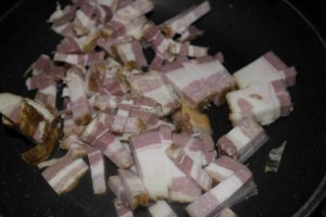 In a large wok (I'm Asian) fry bacon.  Pour out most the drippings except about 3 Tbsp.