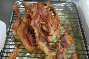 Tray of precooked bacon.