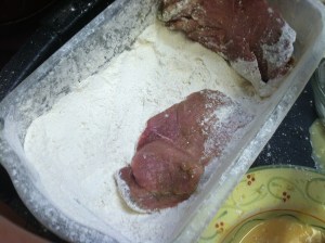 After seasoning, dredge in flour.